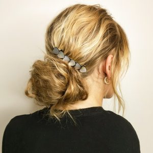 Messy bun with heart shell barrette clip